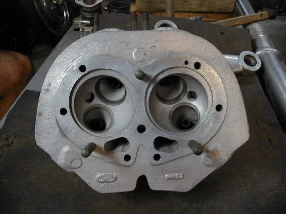 Cylinder head for spigotted barrells