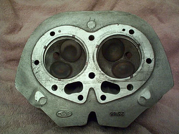 Cylinder head for spigotted barrells