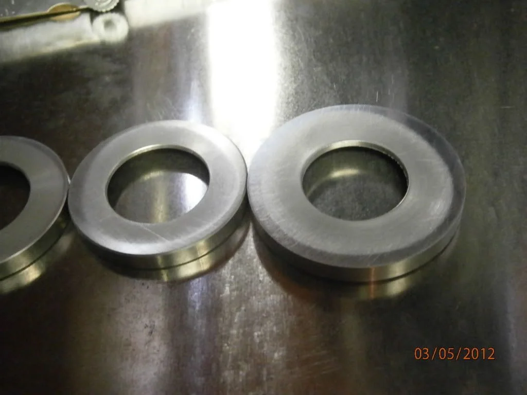 Surface finish on iso end caps, teflon wear