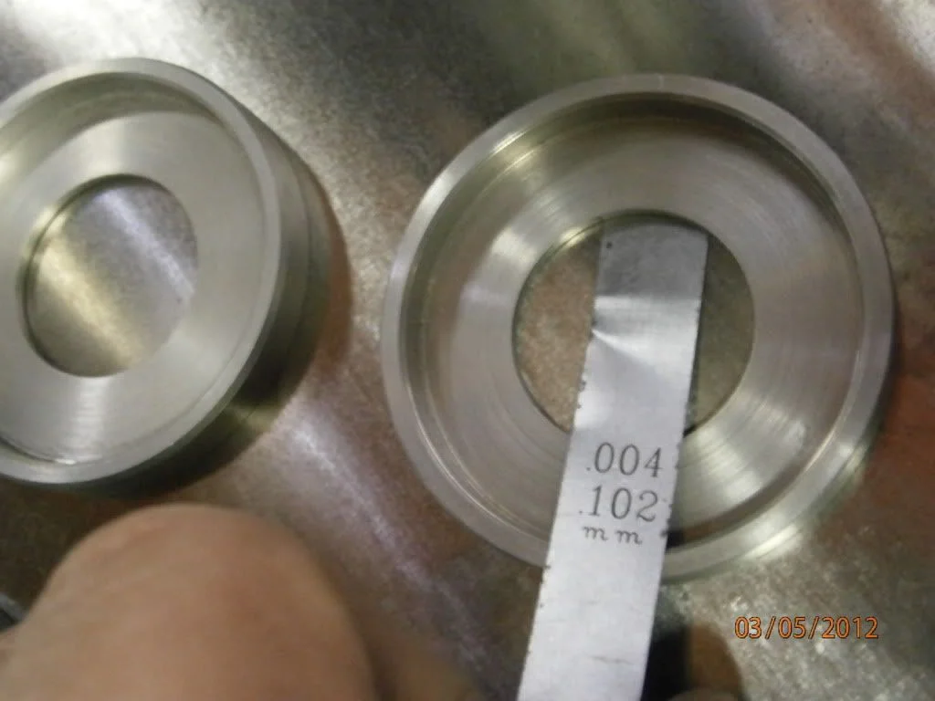 Surface finish on iso end caps, teflon wear