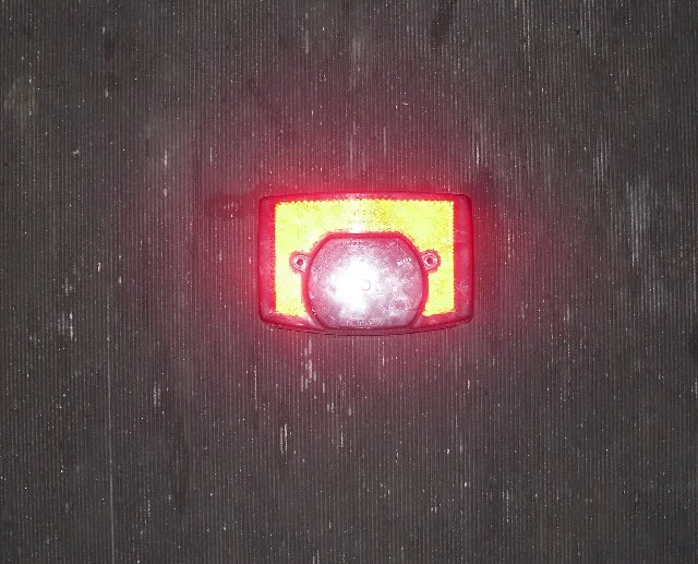 Rear lamp lens...has no reflector??