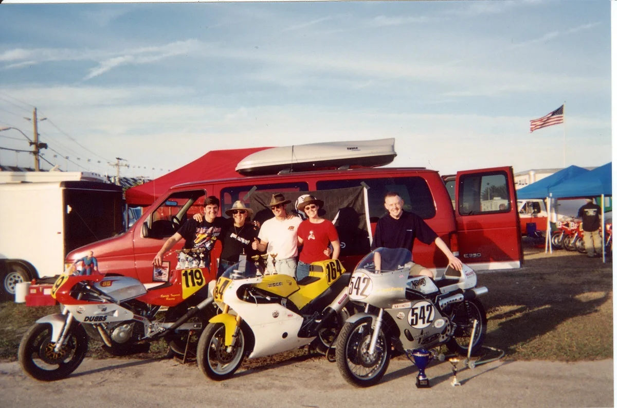 Team with Bikes and Trophies 2 1200.jpg